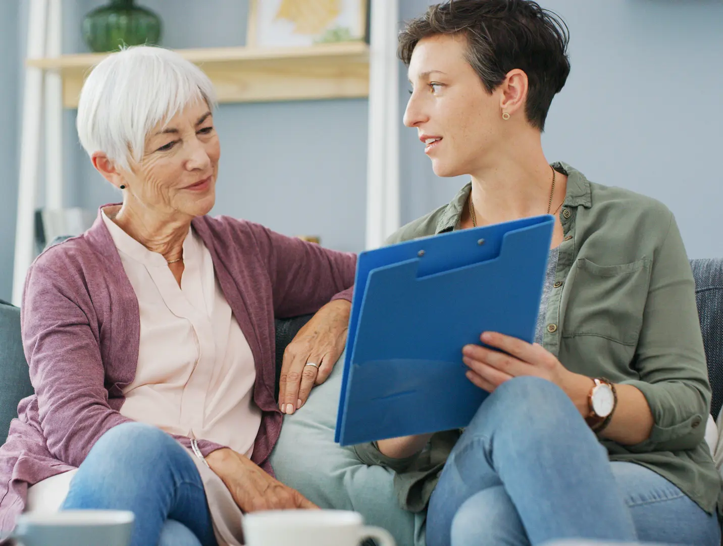 Elderly woman and younger woman discussing