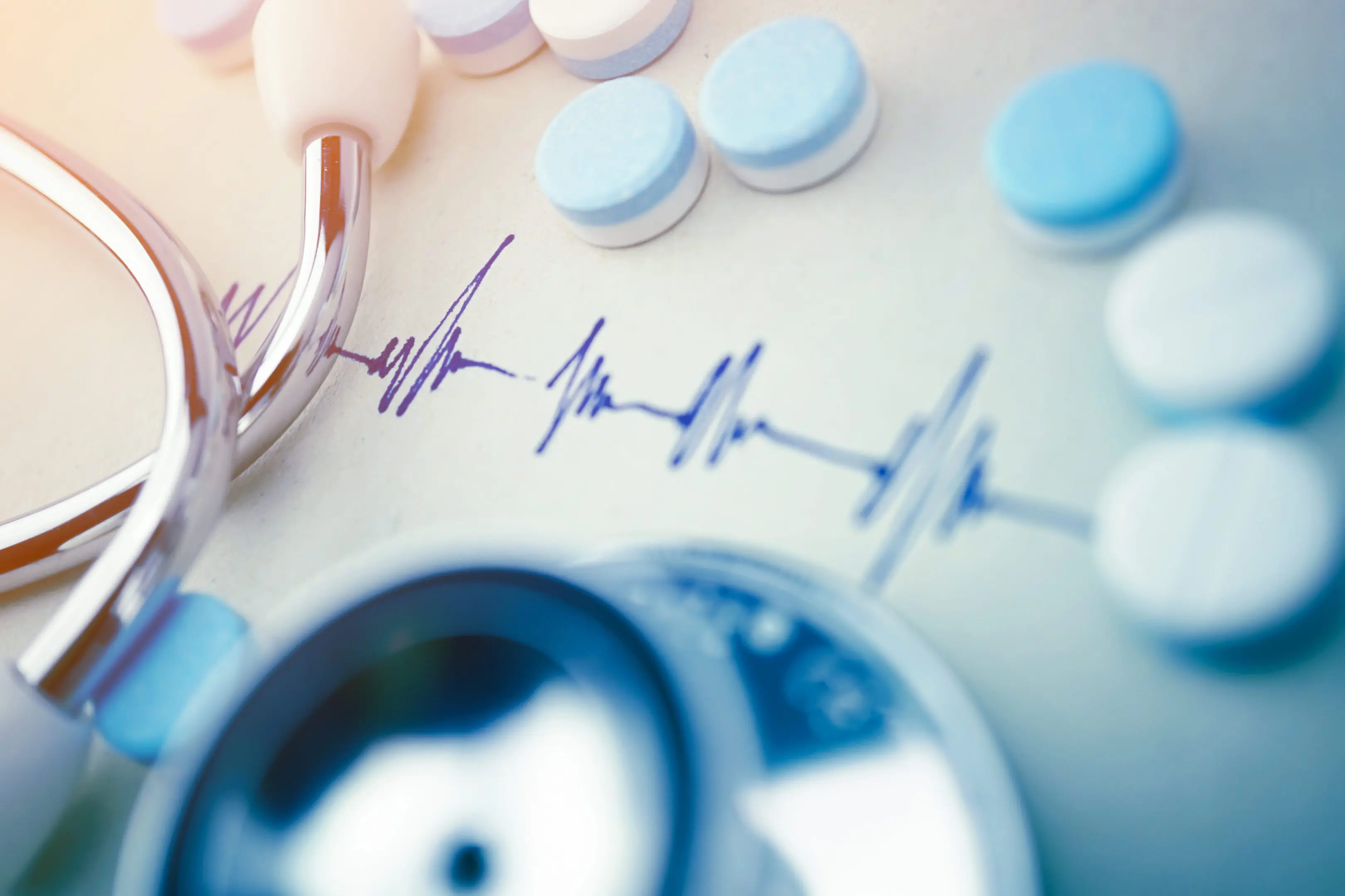 medical-stethoscope-and-pills-on-electrocardiogram-2026-04-14-05-23-33-utc