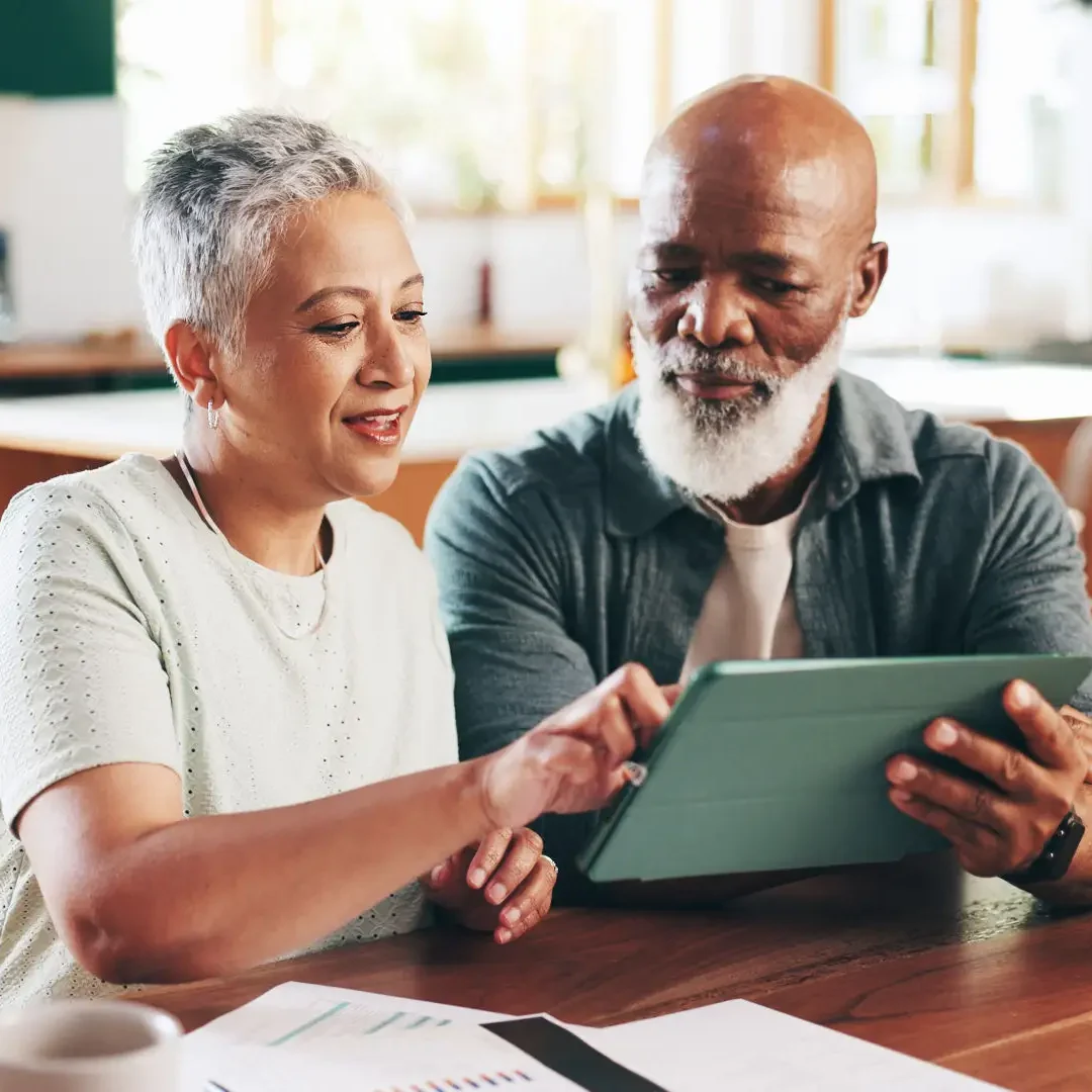 Senior couple using a tablet together at home.